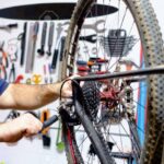 34738841-bicycle-mechanic-in-a-workshop-in-the-repair-process
